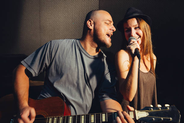 Two young singers performing in the studio.