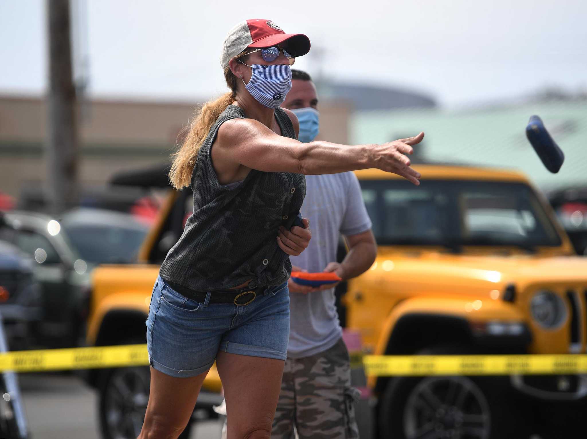Jennifer Lamoureux, of Fairfield, competes in the 5th Annual Connecticut Cornhole State Championships at Two Roads Brewing in Stratford, Conn. on Sunday, August 23, 2020. Lamoureux and teammate Sheila Teed. of Norwalk, won a close first round match.